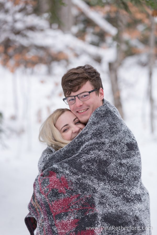 blanket winter engagement photo