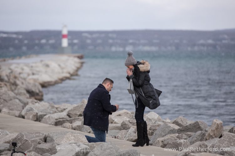 Surprise Engagement Petoskey Northern Michigan pier breakwall lighthouse photography