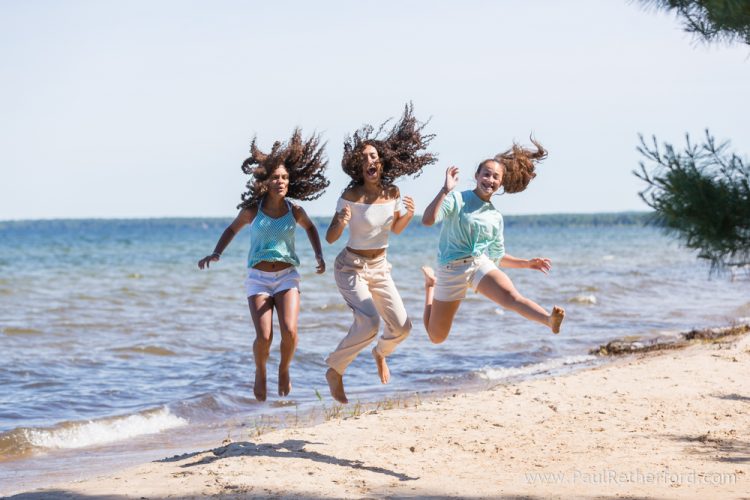 beach jumping family photo
