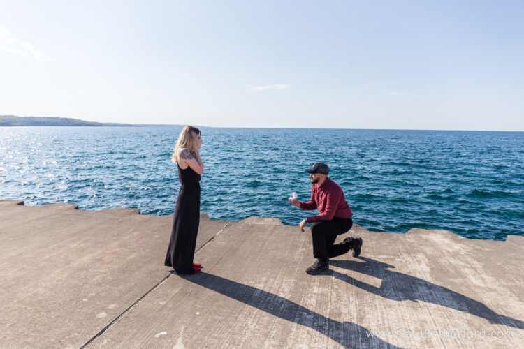 engagement surprise petoskey northern michigan breakwall lighthouse photo