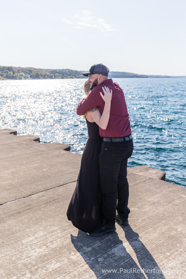 Surprise Engagement Petoskey Northern Michigan breakwall lighthouse Bayfront Park Photography