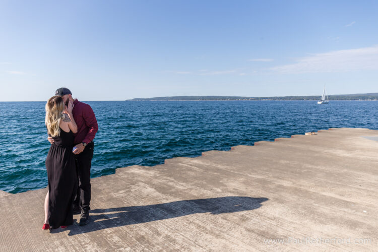 Surprise Engagement Petoskey Northern Michigan breakwall lighthouse Bayfront Park Photography