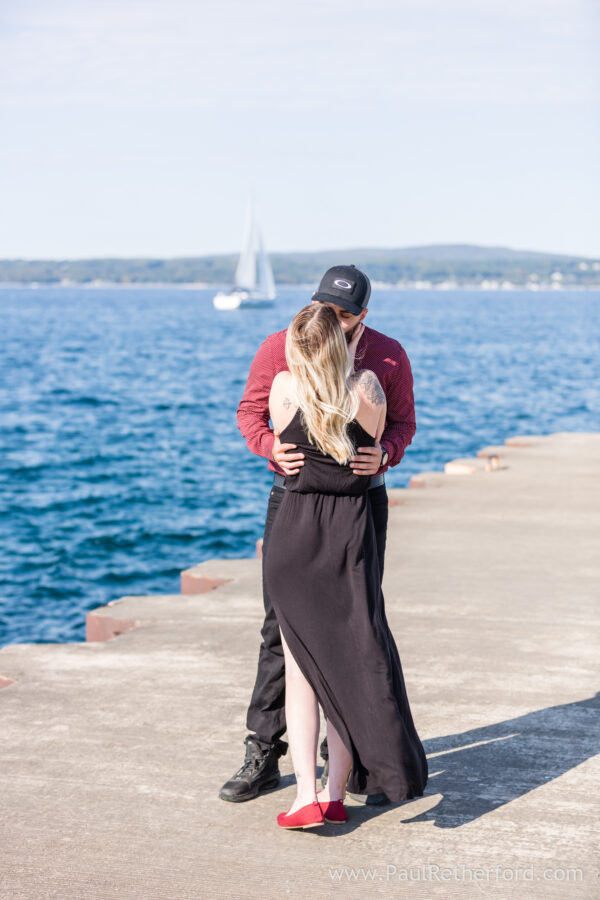 Surprise Engagement Petoskey Northern Michigan breakwall lighthouse Bayfront Park Photography