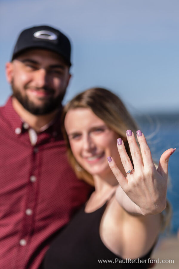 Surprise Engagement Petoskey Northern Michigan breakwall lighthouse Bayfront Park Photography