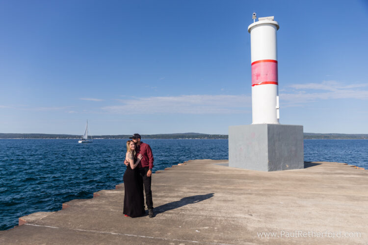 Surprise Engagement Petoskey Northern Michigan breakwall lighthouse Bayfront Park Photography