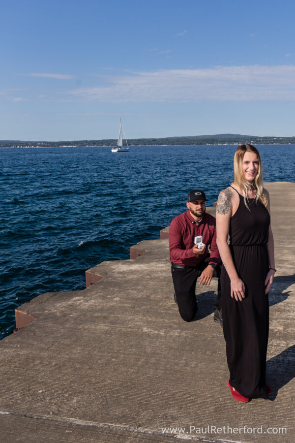 Surprise Engagement Petoskey Northern Michigan breakwall lighthouse Bayfront Park Photography