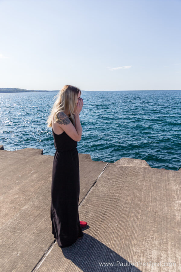 Surprise Engagement Petoskey Northern Michigan breakwall lighthouse Bayfront Park Photography